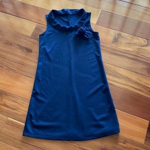 Super cute navy blue dress with rosebud flower attached to left side